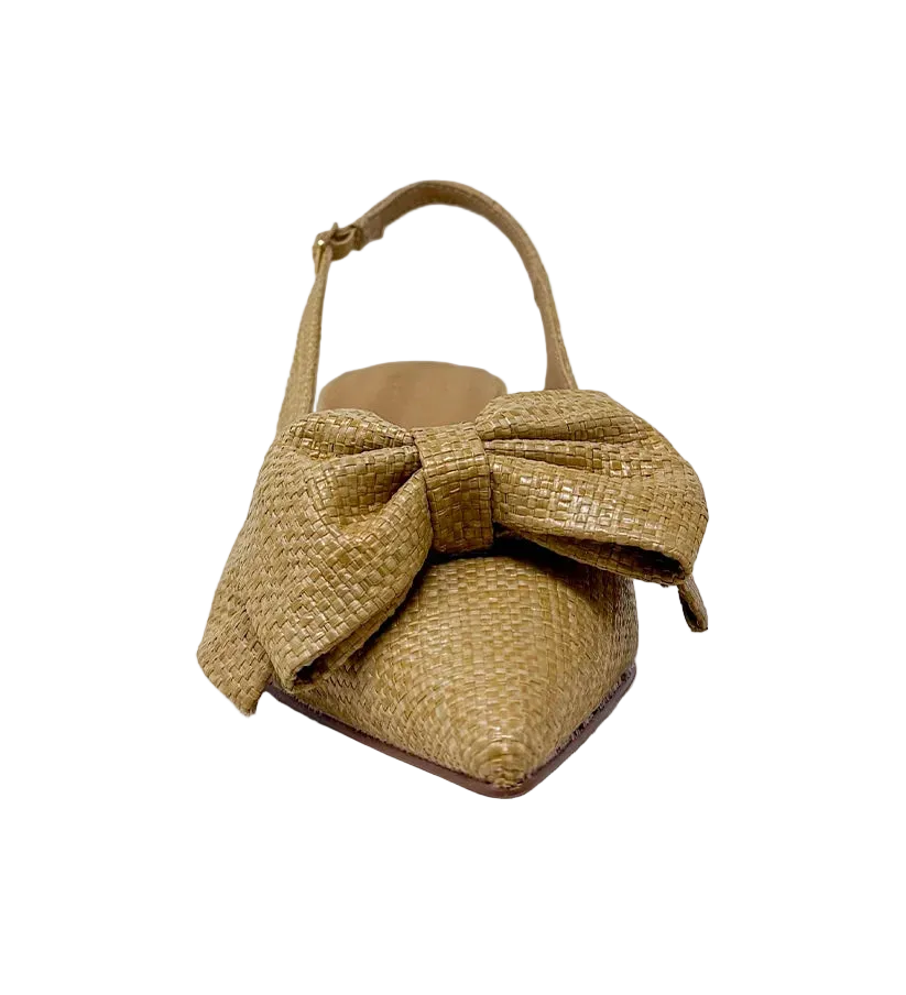 Elevate your everyday style with the Nora Slingback Heel, a refined yet relaxed silhouette designed to keep you on trend from day to night. Featuring a beautifully woven raffia-style texture in a warm natural tone, this pair brings an organic, elevated feel to any look. The soft pointed toe is complemented by a statement knot detail at the front, adding a touch of modern femininity. 