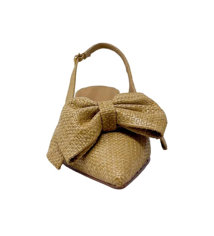 Elevate your everyday style with the Nora Slingback Heel, a refined yet relaxed silhouette designed to keep you on trend from day to night. Featuring a beautifully woven raffia-style texture in a warm natural tone, this pair brings an organic, elevated feel to any look. The soft pointed toe is complemented by a statement knot detail at the front, adding a touch of modern femininity. 