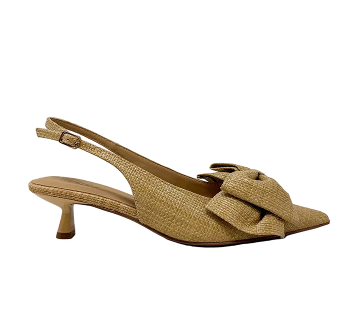 Elevate your everyday style with the Nora Slingback Heel, a refined yet relaxed silhouette designed to keep you on trend from day to night. Featuring a beautifully woven raffia-style texture in a warm natural tone, this pair brings an organic, elevated feel to any look. The soft pointed toe is complemented by a statement knot detail at the front, adding a touch of modern femininity. 