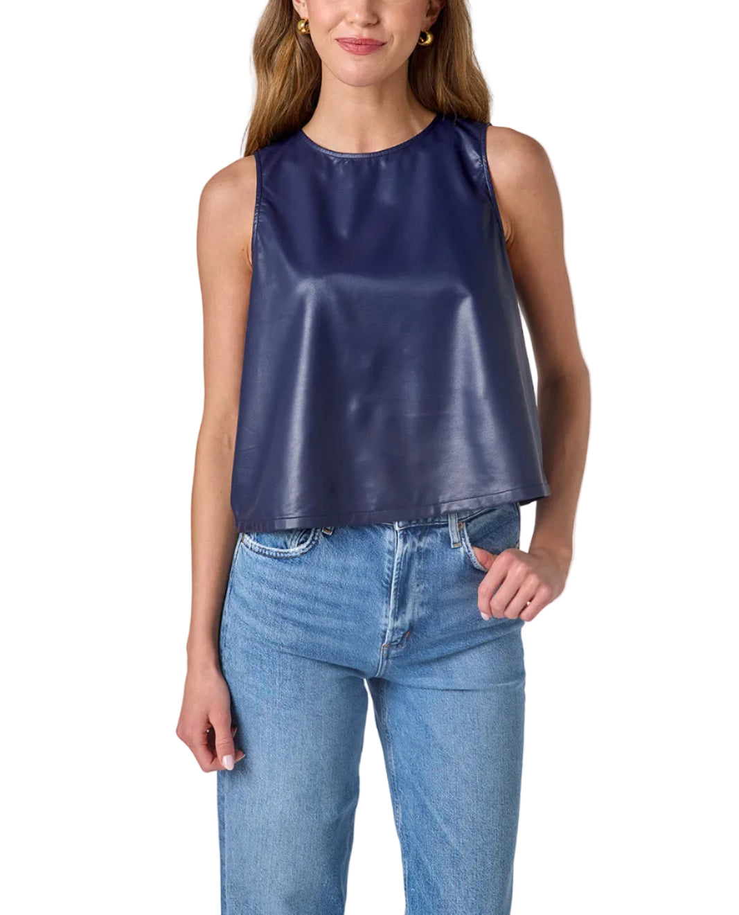 Woman wearing a blue sleeveless top and jeans on a white background