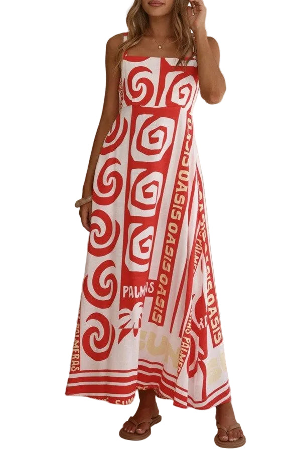 Woman wearing a red and white patterned dress in a room with a vase.