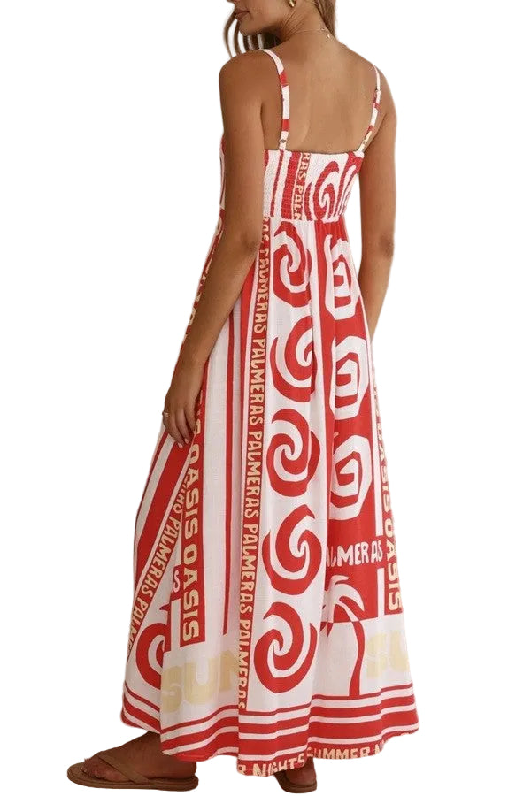 Red and white patterned dress worn by a person indoors.