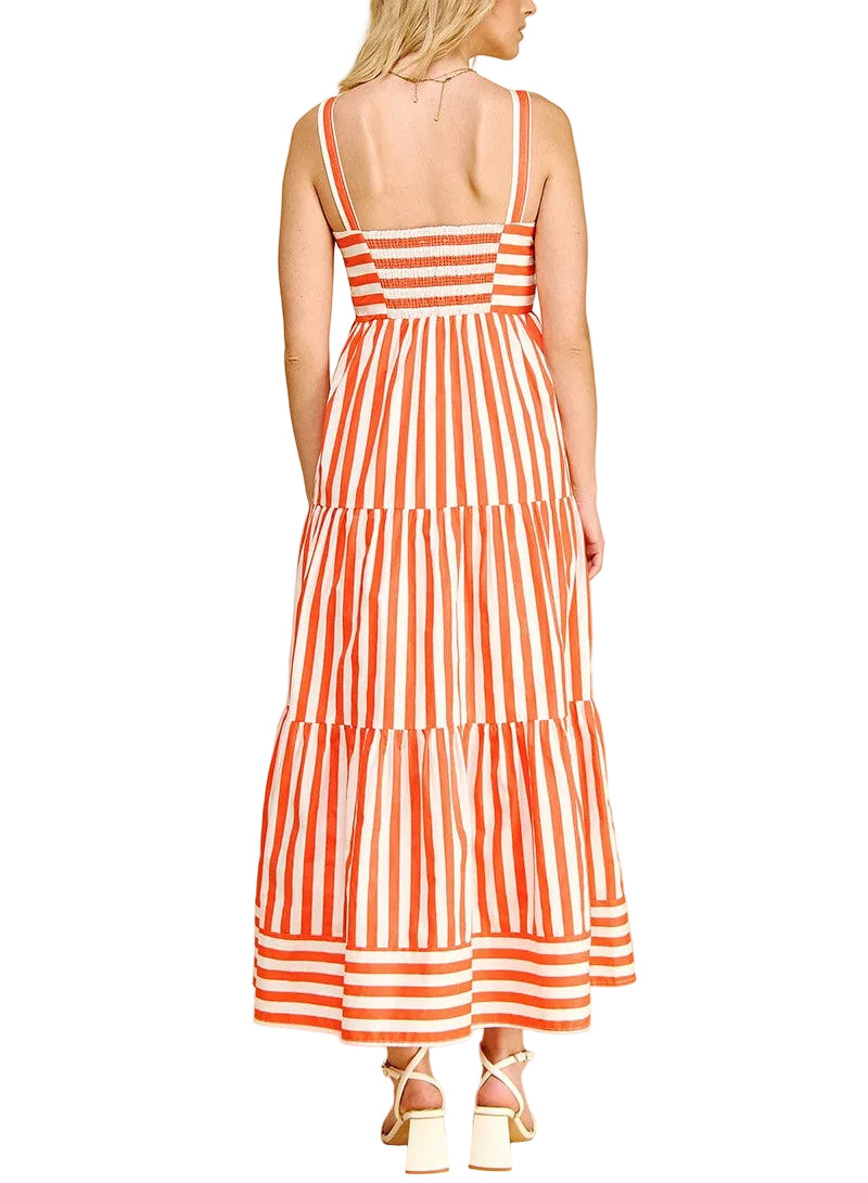 Woman wearing an orange and white striped dress