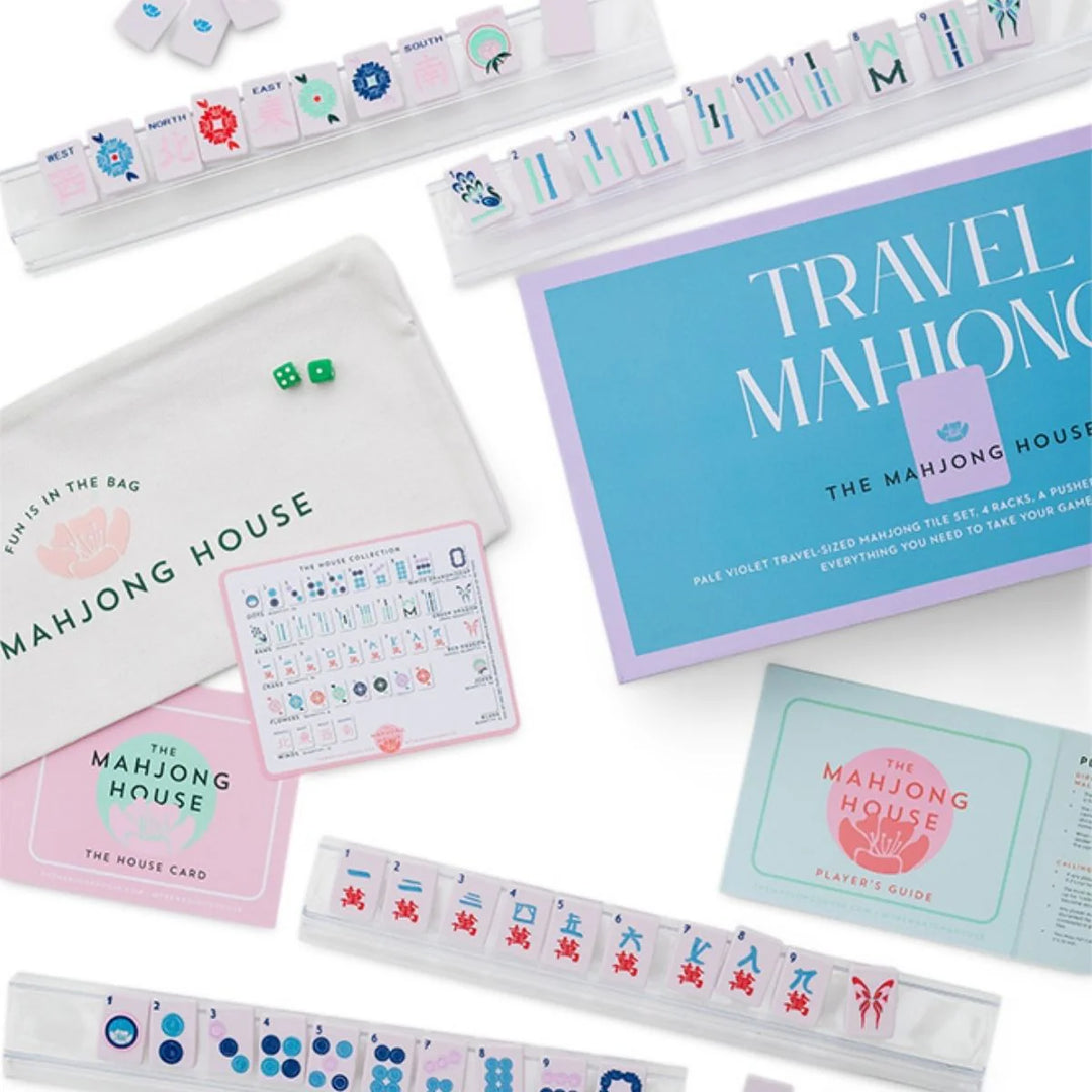 Perfectly sized for on-the-go play, this travel-friendly set includes:
1 set of 160 travel-sized mahjong tiles (36 dots, 36 bams, 36 craks, 8 flowers, 16 winds, 4 white dragons/soaps, 4 green dragons, 4 red dragons, 10 jokers, 6 blanks)
4 racks
1 pusher
1 tile guide
1 player’s guide to mahjong
4 of our House Cards
1 zipper travel bag

Materials:
tiles, racks, and pusher are plastic

Tile dimensions:
36mm x 25mm x 3.6mm

Rack dimensions:
35.8cm x 5.5cm x 2.4cm

Pusher dimensions:
35.8cm x 3cm