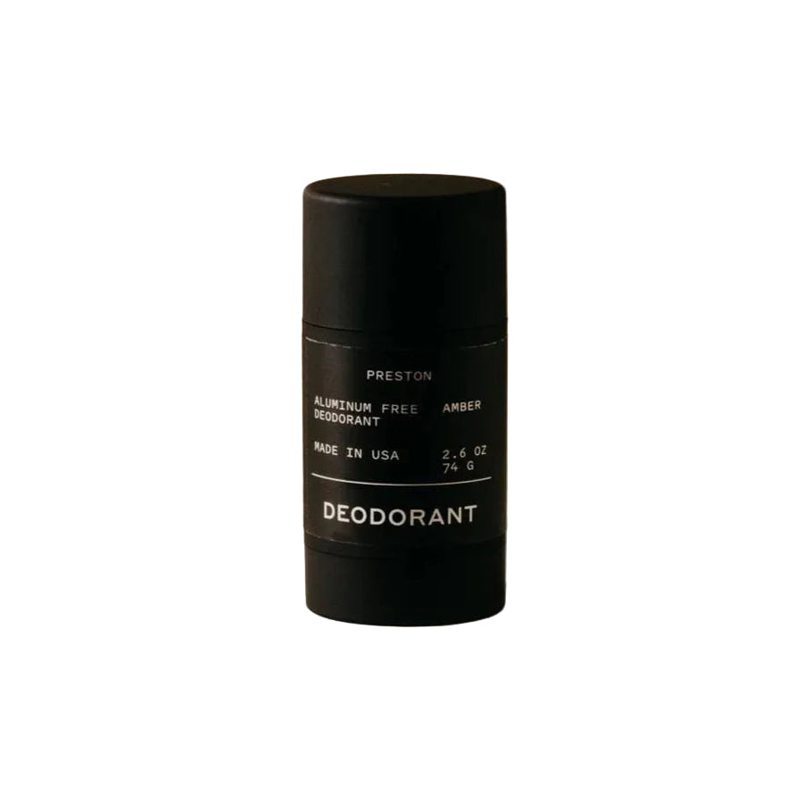 Black deodorant container on a beige background