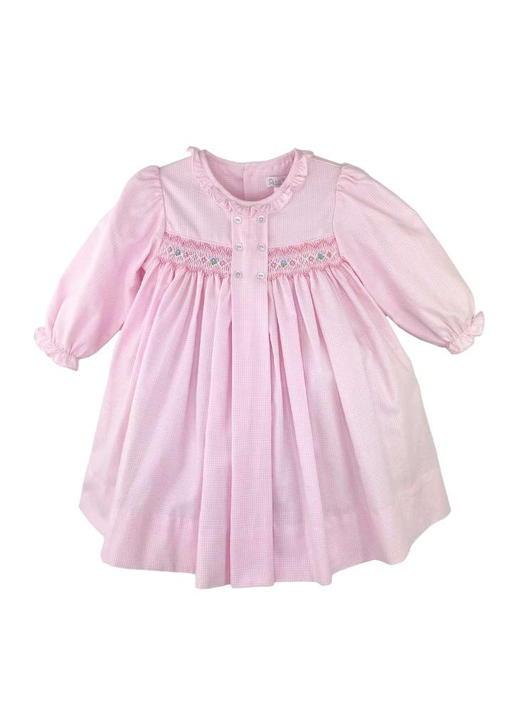 AN CLASSIC AND SIMPLE DRESS THAT IS PERFECT FOR FALL WITH CHARMING SMOCKING AND DELICATE EMBROIDERY, YOUR LITTLE ONE WILL BE COMFORTABLE WITH A TOUCH OF SWEETNESS!

This long sleeve dress comes in a pink check fabric that is perfect for fall and winter with a center box pleat with decorative buttons and a smocked panel with embroidered details.

The lightweight cotton blend fabric keeps little ones cool and comfortable and is easy to care for - just machine wash and tumble dry. 