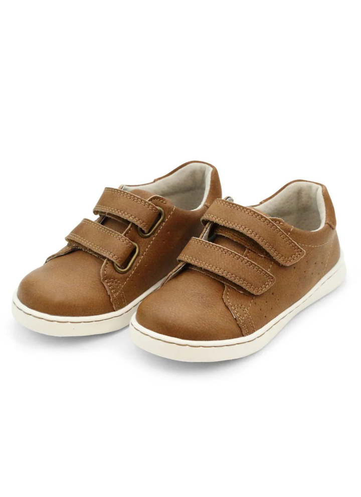 Light and sporty, the Kyle sneaker is perfect for little fun-seekers. This shoe is the trifecta of style, comfort, and convenience. Features matching counter trim, a fine touch you cannot miss. This shoe comes with a leather sock bed with memory foam for greater breathability, durability, and comfort as leather conforms to the shape of the foot.
