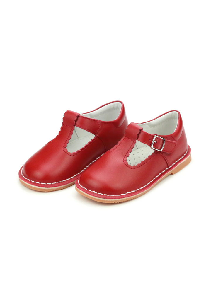 Selina is what we call an irresistibly pretty shoe. The scalloped detail on the t-strap is hard to miss. She&