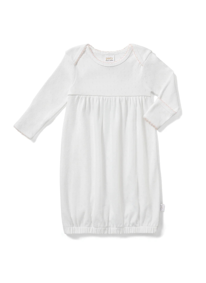 Designed with a softly gathered silhouette and finished with delicate picot trim at the neckline and cuffs, this gown blends comfort with classic detail. The elasticized hem makes diaper changes quick and convenient while keeping baby cozy.