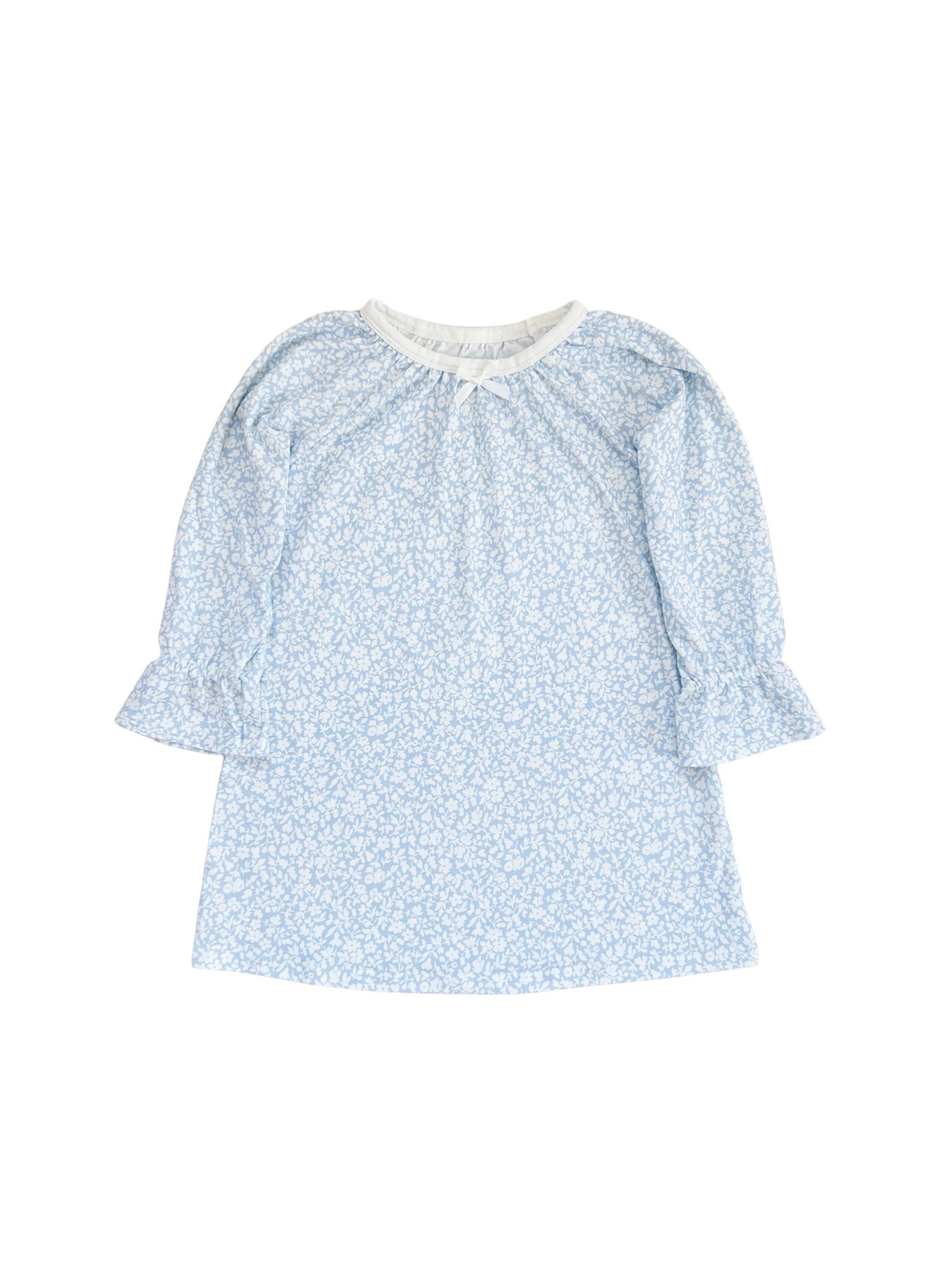 A light blue and white floral print long-sleeve blouse with a gathered neckline and ruffled cuffs, shown flat on a white background.