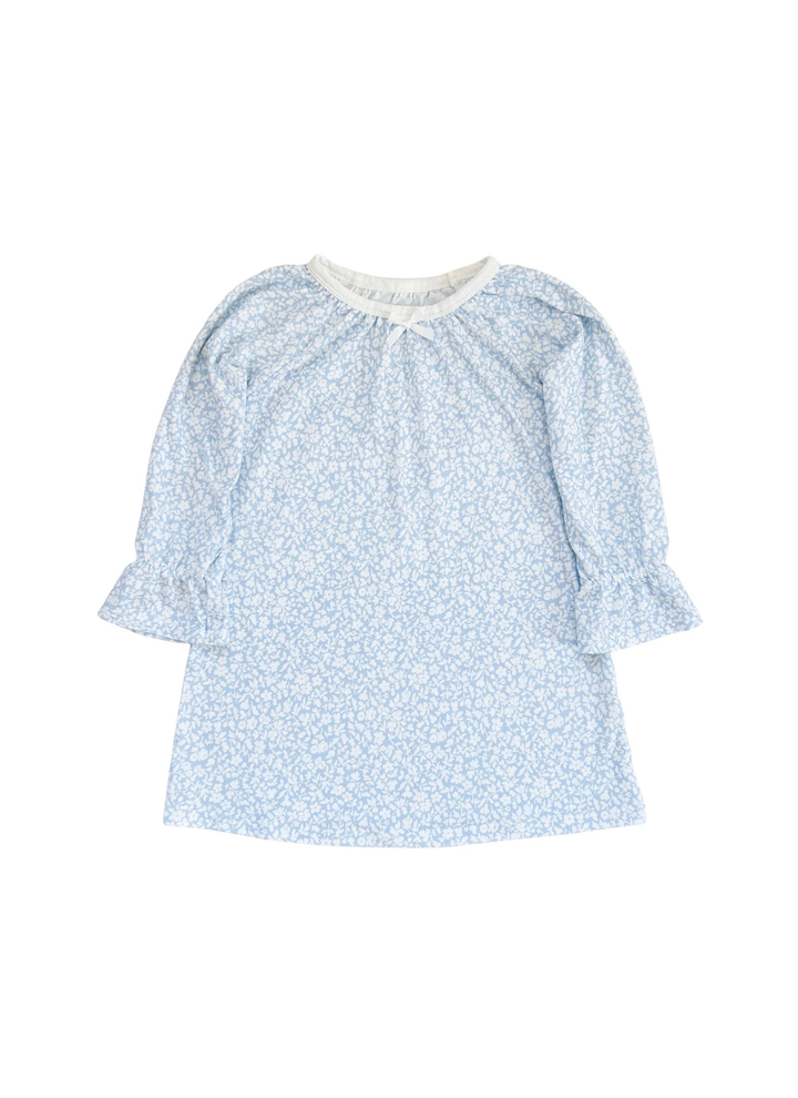 A light blue and white floral print long-sleeve blouse with a gathered neckline and ruffled cuffs, shown flat on a white background.