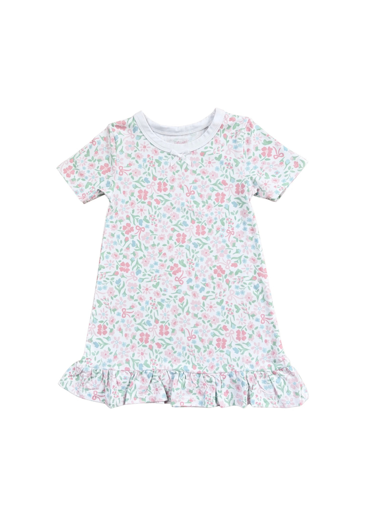 A short-sleeve baby dress with a delicate pink and green floral pattern on a white background, featuring a ruffled hem and a white ribbed crew neck.