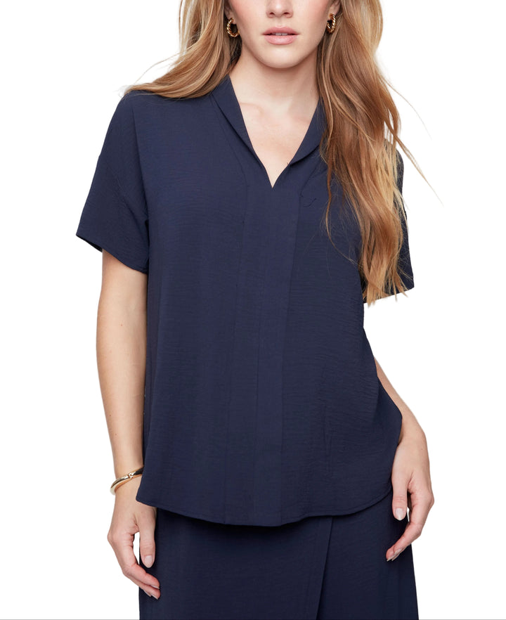 Effortless elegance meets everyday comfort in the Sheila Short Sleeve Blouse. This charming v-neck button-up features a crisp collar and short sleeves, making it the perfect go-to for layering or wearing solo. Whether you're dressing up for the office or keeping it casual, Sheila brings a touch of sophistication to any outfit. Versatile, flattering, and ready for anything your day brings.