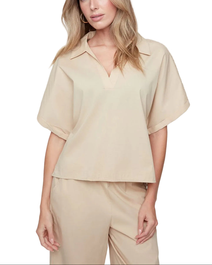 Effortlessly chic and ready for anything, the Susie Short Sleeve Top features a flattering V-neckline that&