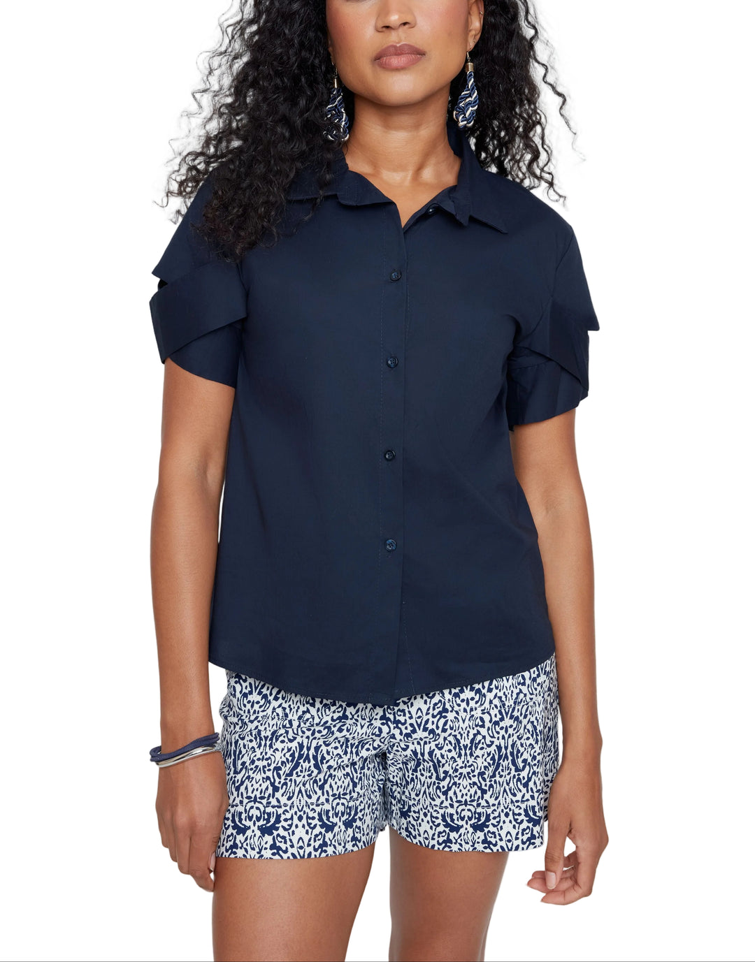 Effortless style meets everyday comfort with the Molly Short Sleeve Blouse. This versatile piece features a relaxed fit that works just as well tucked into your favorite jeans as it does layered over a tee. The breathable fabric keeps you cool through the day, while the classic silhouette ensures you'll reach for it again and again. Perfect for casual outings or dressing up with the right accessories—your new wardrobe staple awaits.