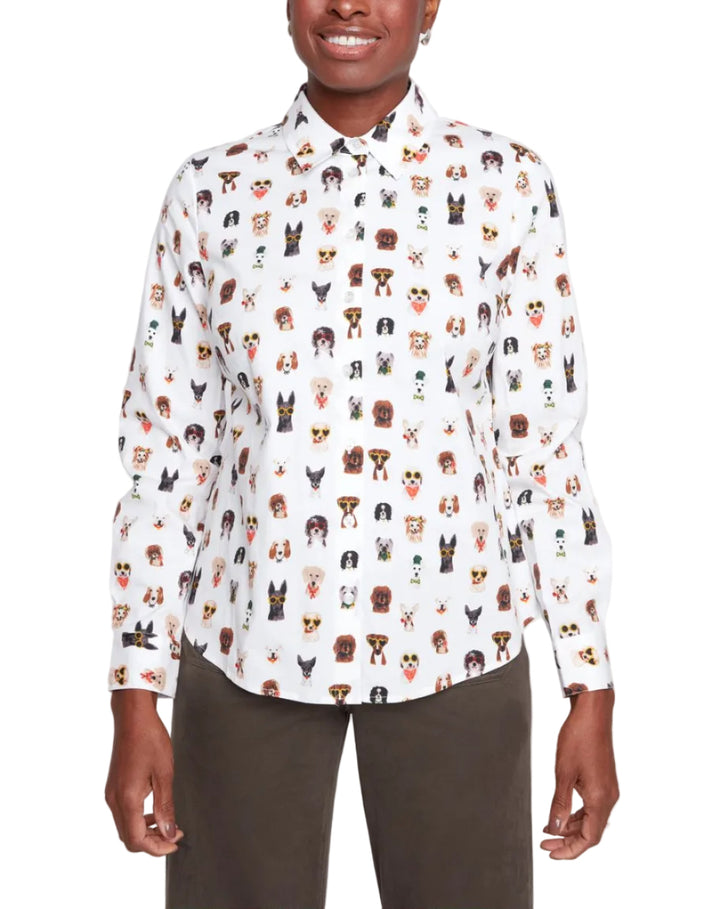 Person wearing a white shirt with dog pattern against a white background