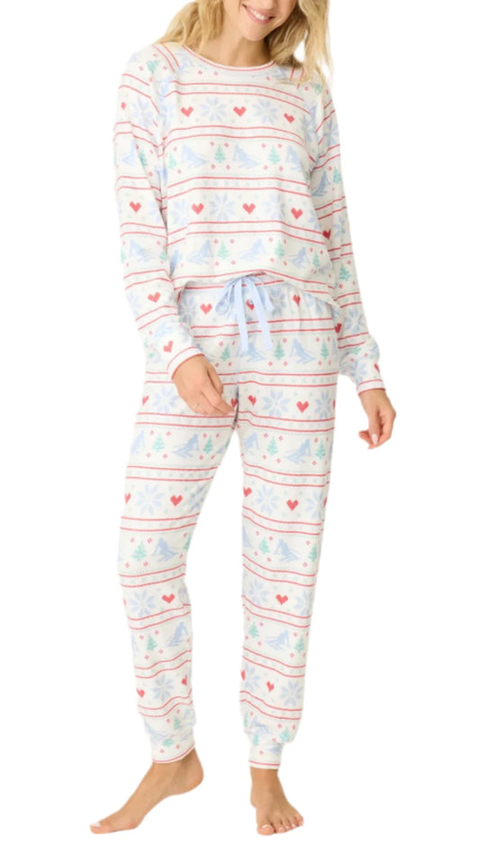 Embrace the spirit of winter with exclusive jammie set featuring a playful ski themed pattern. The soft fabric ensures all day comfort, while the stylish design makes it perfect for cozy nights at home or festive gatherings. Enjoy a relaxed fit that keeps you warm and stylish during the colder months.

DETAILS
Women's white jammie top
Banded PJ pant
Ski-theme pattern