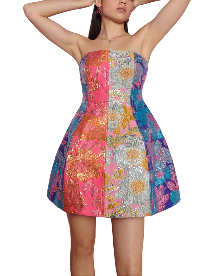 Make a radiant statement in the Cosmica Mini Dress by CeliaB — a vibrant, strapless silhouette crafted from multicolored metallic jacquard. Featuring a structured bodice and flared skirt, this mini is all about confident femininity. Bold floral patchwork brings the drama, while the fit keeps it effortlessly flattering. Perfect for summer soirées, weddings, or a night out when you’re ready to shine.