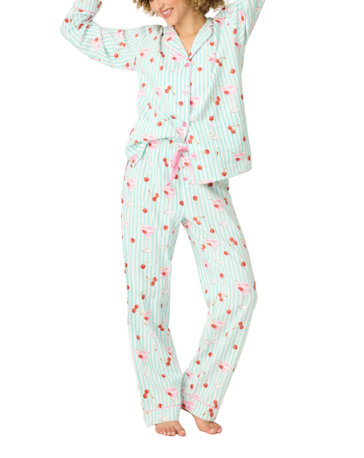Sleep, lounge, repeat in this dreamy three-piece flannel set with a splash of happy hour charm. Made from soft cotton in a classic twill weave, it includes a button-up shirt, relaxed-fit pants, and a matching headband. Patterned with minty stripes, pink cocktails, and cheery little cherries, it’s a playful pick for sleepy nights, slow mornings, or unwinding with your favorite drink in hand.