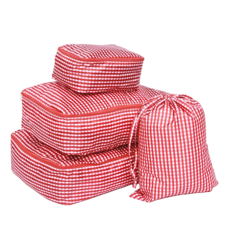 Set of red and white checkered packing cubes on a white background