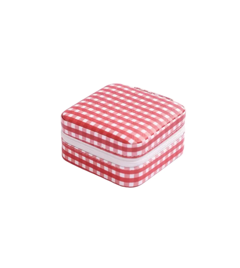 Red and white checkered square box on a light pink background