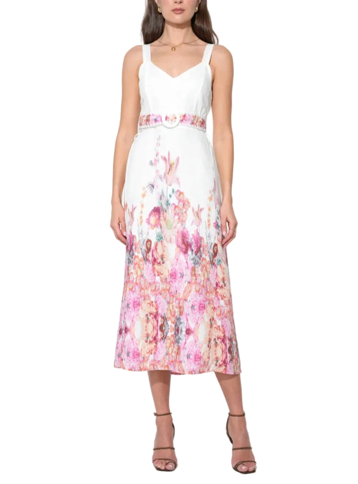The blooms are strategically positioned—often "growing" upward from the hem and cascading down from the shoulders—to draw the eye vertically and create an elongating, slimming effect. The V-neckline provides a classic, flattering frame for the décolletage, while the midi-length skirt offers a graceful, sophisticated sweep.