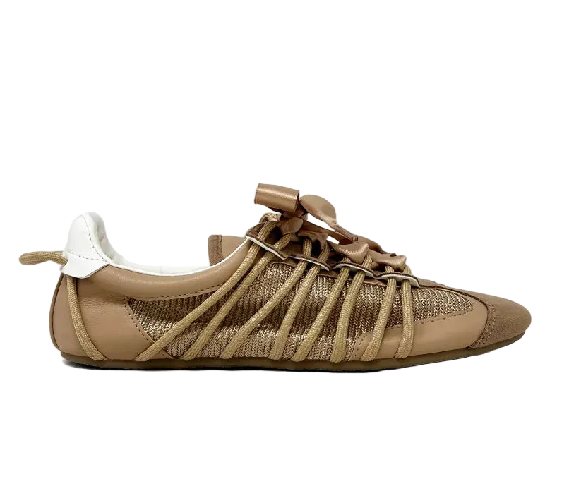 SHERYL in Taupe blends earthy tones with feminine charm in a ballet-meets-sneaker silhouette. Its warm taupe hues, airy mesh upper, and satin ribbon laces make it the perfect style for transitional dressing. Light on your feet, rich in detail, this is effortless sophistication for the everyday muse.

From morning errands to weekend escapes, SHERYL has your back.

Key Features

Upper: Taupe faux leather and mesh with tonal faux suede overlays

Closure: Taupe satin ribbon laces add a soft contrast

