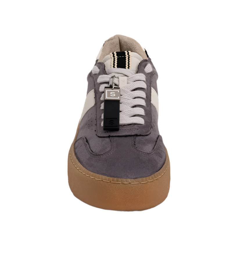 Bold. Casual. Elevated. The STACEY in Grey Suede redefines off-duty cool with its sleek silhouette, contrast details, and chunky sole. Crafted from soft faux suede in a deep grey tone, this sneaker features a cream panel, zebra-print heel tab, and a caramel-toned platform sole that adds subtle height. Whether you're running errands or stepping out for brunch, this pair delivers all-day comfort with a fashion-forward edge.