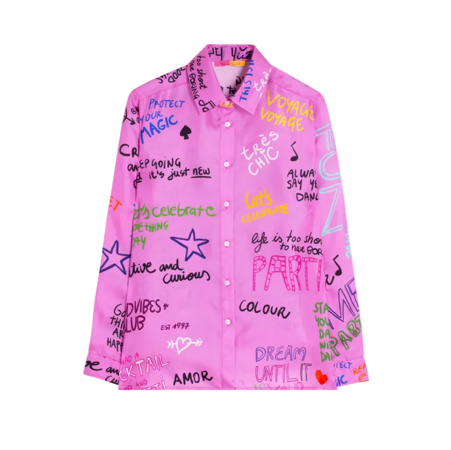 A bright pink button-up shirt covered in colorful graffiti-style text, stars, and doodles, shown flat against a light gray background.