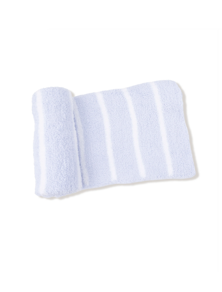 A light blue and white striped plush bath towel, folded to show its soft texture, set against a plain white background.