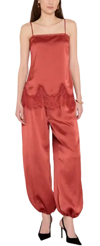 The Audra Top in Santa Fe, a warm terracotta red in luxurious charmeuse. Straight-neck cami with elegant scalloped lace at hem and delicate lace trim detail across the neckline. Pairs with the Torrie Pants for a polished matching set.