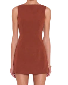 The Ines Romper in harvest, a warm reddish brown. Sleeveless boat-neck mini with high side slits exposing built-in shorts. A tailored and bra friendly cut in a medium-weight fabric, with invisible zipper at center back and lined throughout.
