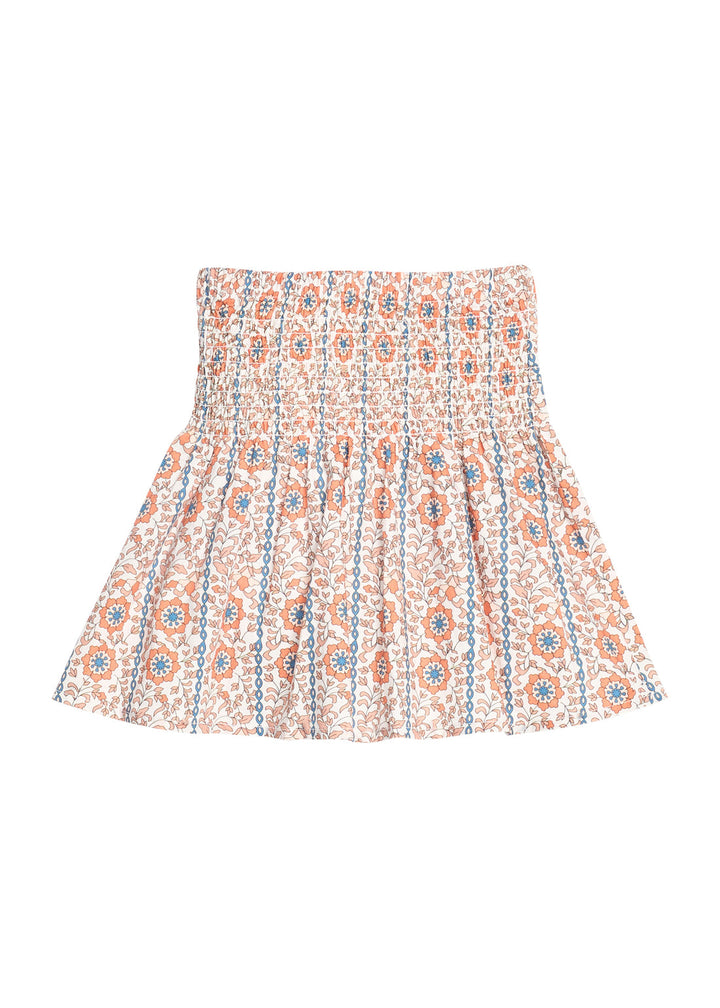 A pleated mini skirt with a smocked waistband, featuring an all-over vertical stripe pattern of orange, blue, and white floral motifs. bibs