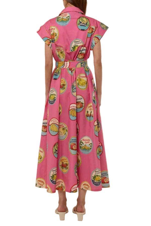 Pink dress with colorful vintage-style label print on a white background