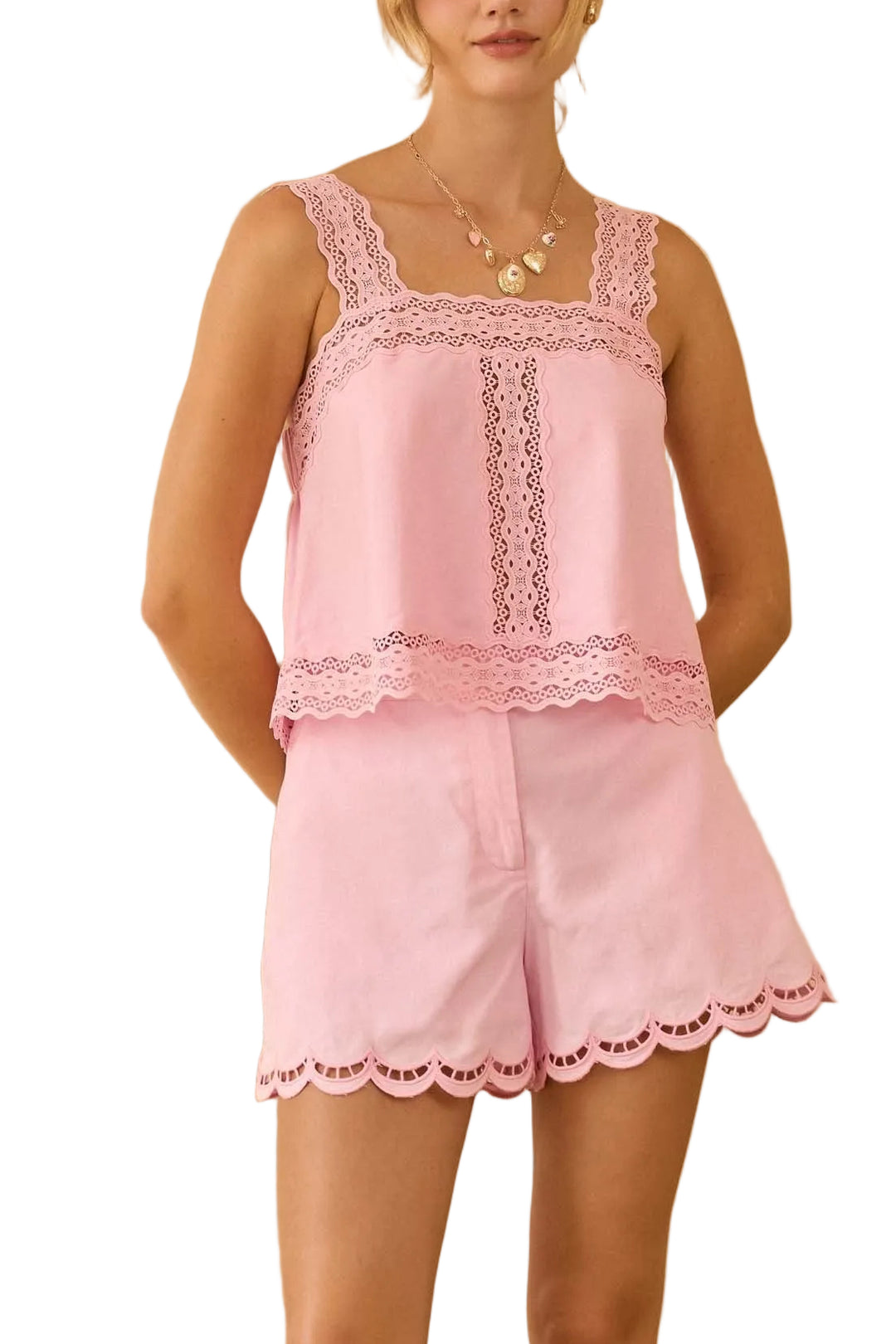 Effortlessly chic and oh-so-charming, this sleeveless top features a flattering square neckline and delicate lace trim that adds a touch of romance to your everyday look. The soft strawberry milk hue is perfect for layering or wearing solo, making it a versatile wardrobe essential that transitions seamlessly from casual days to special occasions. Slip it on and feel the confidence boost!