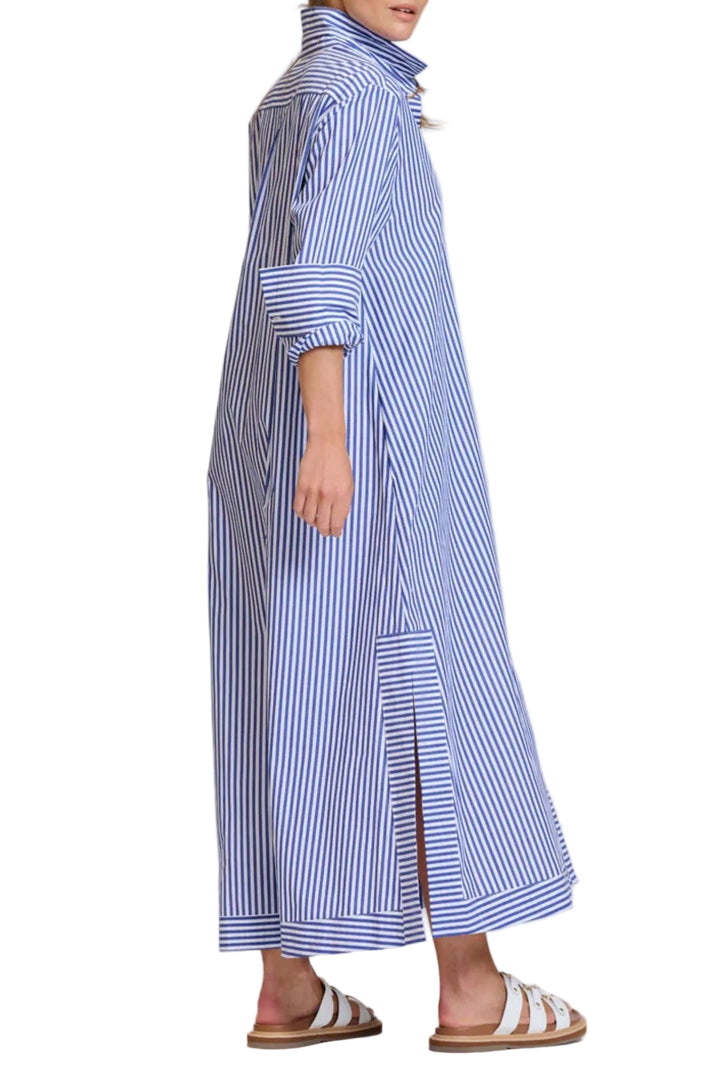 Woman wearing a long blue and white striped dress on a white background