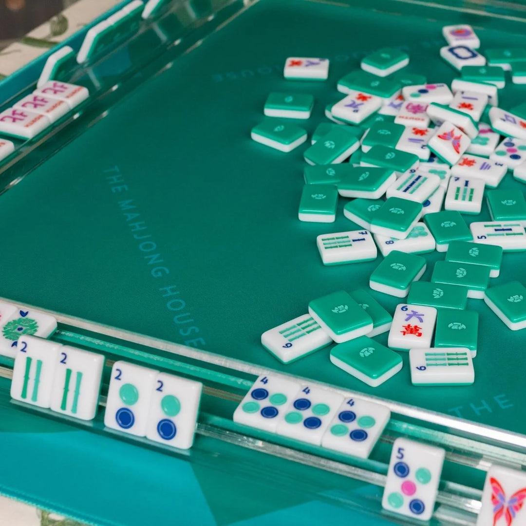 Material:
Acrylic

Dimensions:
Each tile is 1" x 1 & 7/16" x 7/16"

Weight:
Approx. 5 lbs total

INCLUDED:
1 set of 160 mahjong tiles (36 dots, 36 bams, 36 craks, 8 flowers, 16 winds, 4 white dragons/soaps, 4 green dragons, 4 red dragons, 10 jokers, 6 blanks)
1 tile guide
1 player’s guide to mahjong