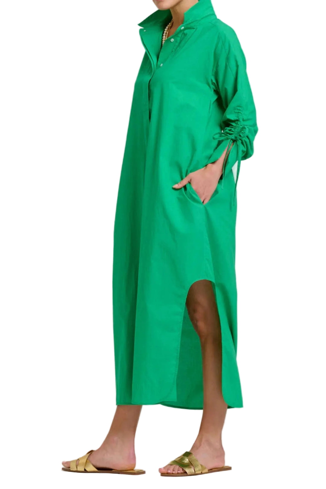 Woman wearing a green dress on a white background