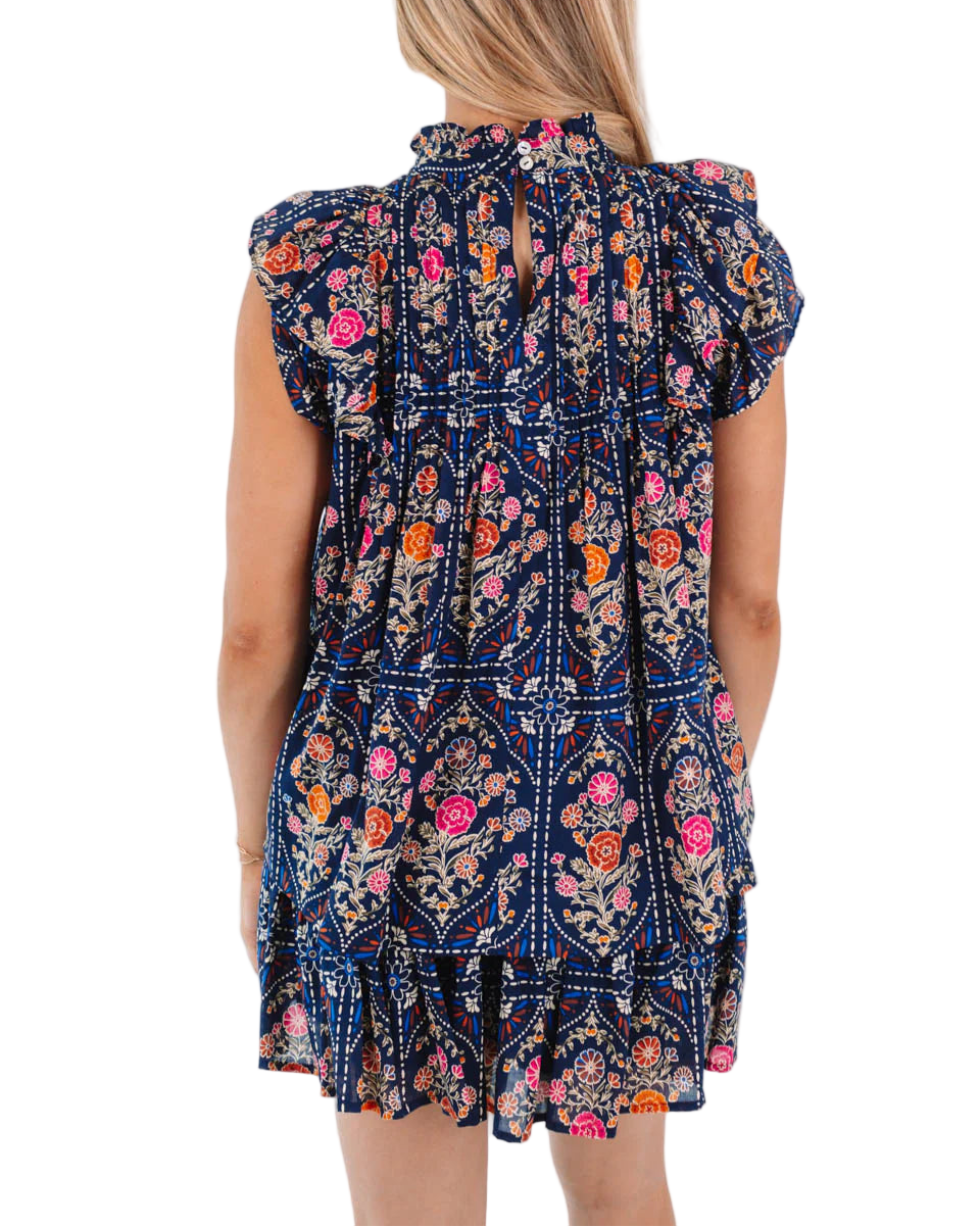 This navy top is perfect for fall days, featuring delicate pleated details and playful ruffles for a breezy, feminine look. The flowy silhouette ensures comfort and ease, making it an ideal choice for a relaxed, sun-filled day. Pair it with shorts or our Torian Ruched Skort for a fresh, effortless vibe!