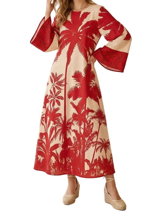 Woman wearing a red and white floral dress in a minimalistic room.