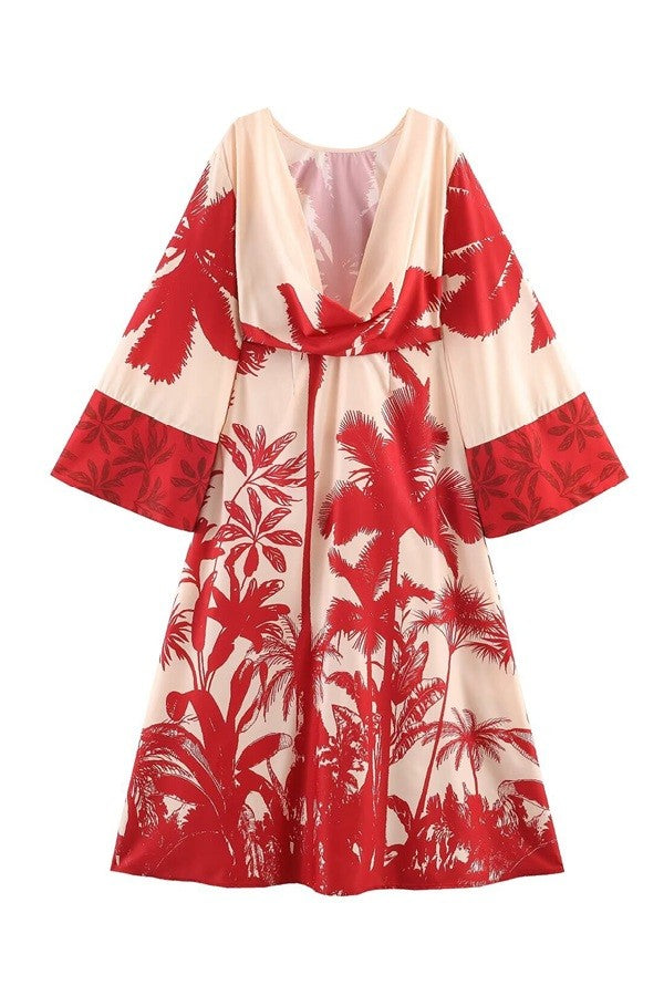 Red and white floral patterned dress with a belt on a white background