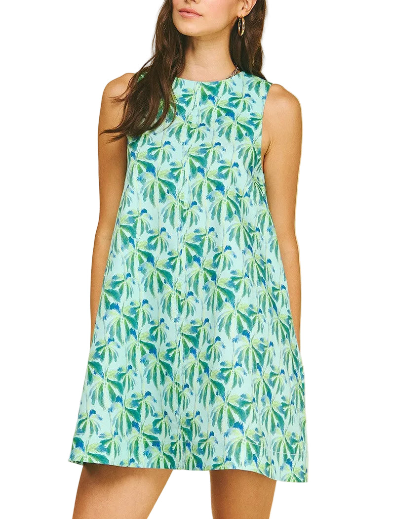 Woman wearing a green leaf-patterned mini dress