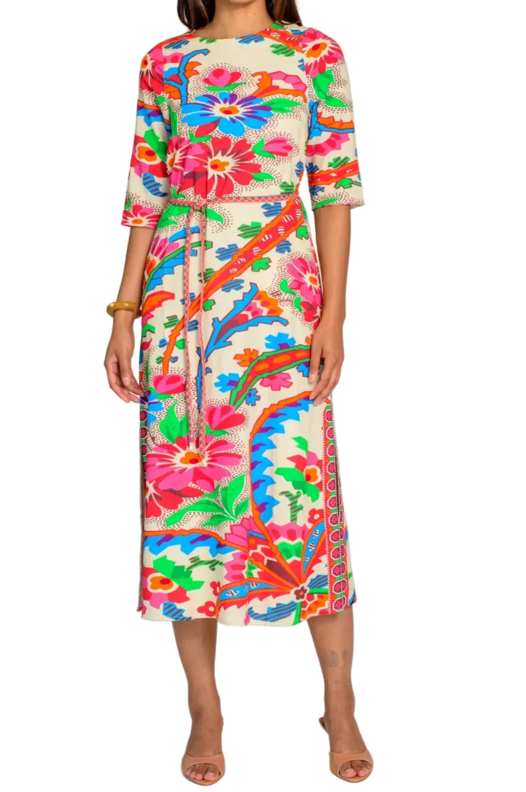 Woman wearing a colorful floral dress on a white background