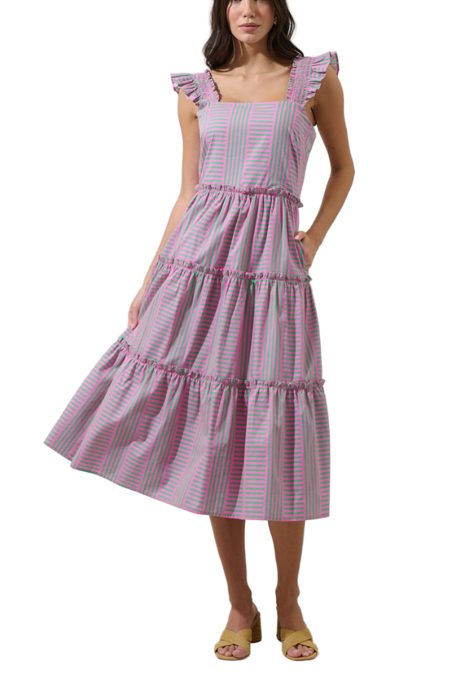 Woman wearing a pink and white striped dress on a white background