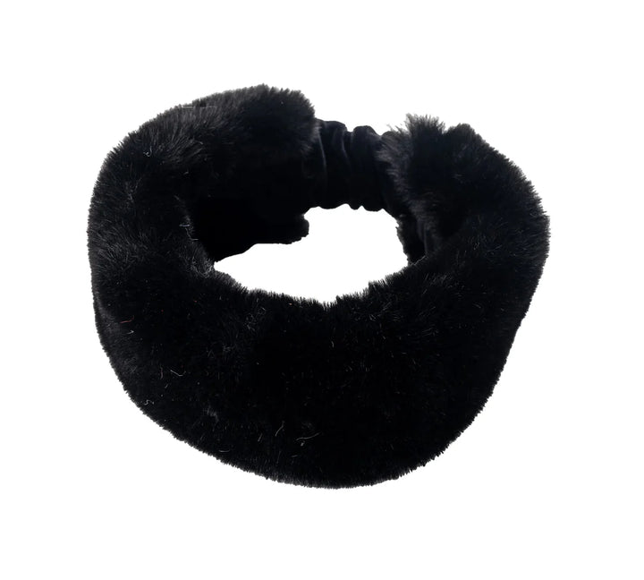 The Aspen Fur Turban is the ultimate accessory for the colder months, offering both warmth and a touch of luxe. Crafted from plush faux fur, this turban wraps your head in softness while adding a bold, statement-making element to your winter wardrobe. Its sophisticated design elevates any outfit, whether you're out in the snow or curled up with a hot drink by the fire.

Perfect for those who want to stay warm without sacrificing style, this turban is the epitome of winter glamour.