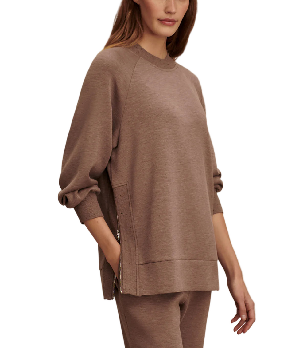 This sweatshirt offers an oversized, boyfriend-style fit, inspired by our popular Mae design. Featuring long side zips with rib inserts, a classic crew neck, and a deep hem, it's perfect for easy-going days paired with sweatpants or leggings.