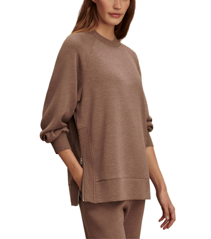 This sweatshirt offers an oversized, boyfriend-style fit, inspired by our popular Mae design. Featuring long side zips with rib inserts, a classic crew neck, and a deep hem, it's perfect for easy-going days paired with sweatpants or leggings.