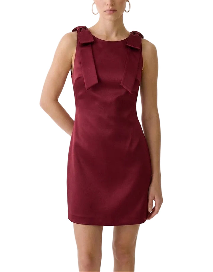 Effortless elegance in a sleek black mini. This boat neck sleeveless dress offers a timeless silhouette perfect for casual outings or dressed-up evenings. The minimalist design flatters all body types while the lightweight fabric ensures comfort throughout the day. Pair with sneakers for a relaxed vibe or heels for an instant polish. A versatile wardrobe essential that transitions seamlessly from season to season.