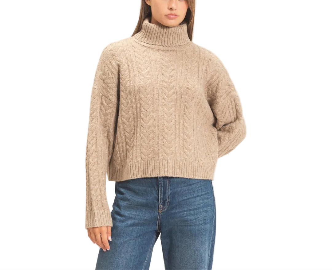 Effortless sophistication meets timeless comfort in the Marisa Cable Knit Turtleneck Sweater. This classic piece features a chunky cable knit texture that adds visual interest and warmth, perfect for layering or wearing solo. The fitted turtleneck and ribbed cuffs provide a polished silhouette, while the soft knit fabric drapes beautifully against the skin. Ideal for cooler seasons, this versatile sweater pairs seamlessly with jeans, trousers, or skirts for an elevated everyday look.