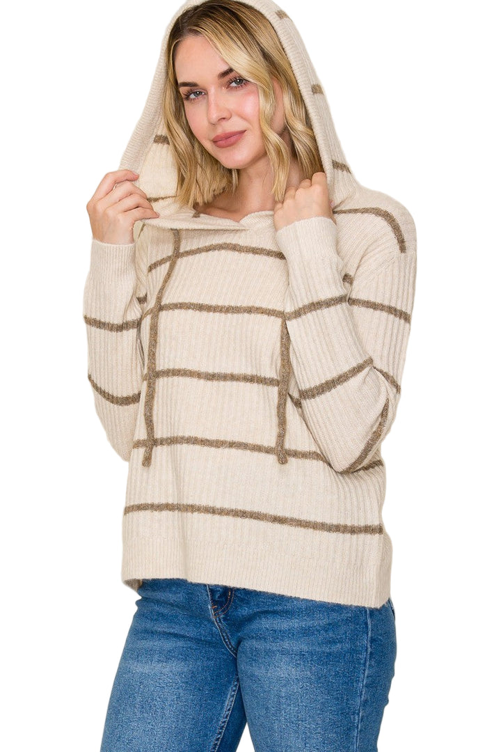 Stay cozy and cute in the Rachel Striped Hoodie Sweater. Its playful stripes and adjustable drawstring neck add a fun twist to your casual look while keeping you warm. Perfect for laid-back days or layering up for chilly adventures.
